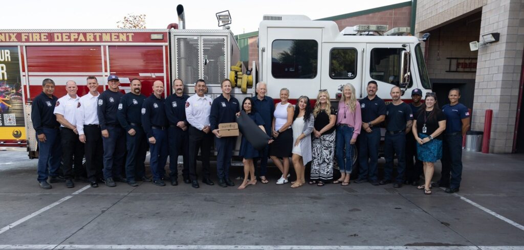 Olivia Ramirez Smith with the Phoenix Fire Department during a First Responder program donation.